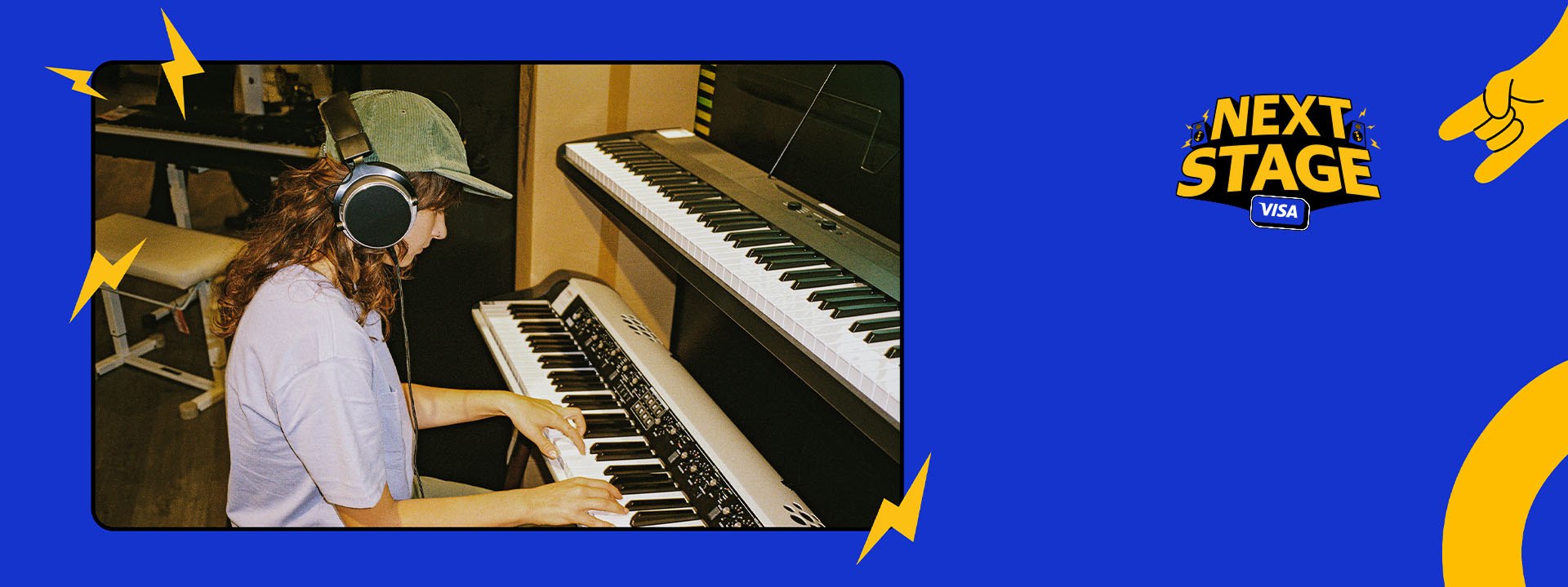 Person wearing headphones playing an electronic keyboard in a music studio, with Next Stage Visa branding.