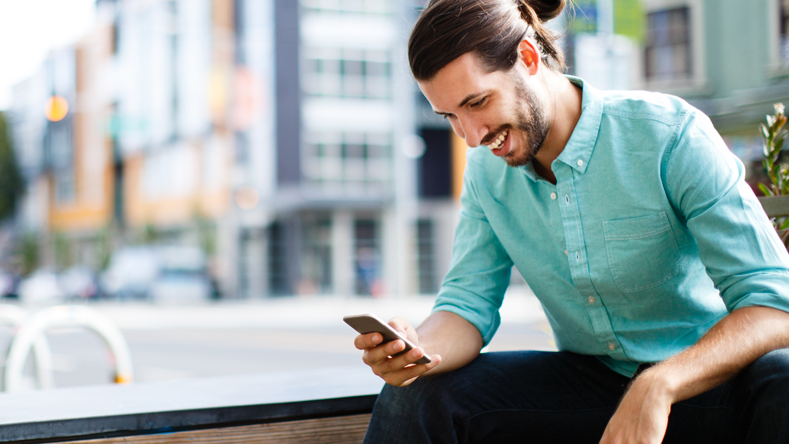 man looking at mobile phone 